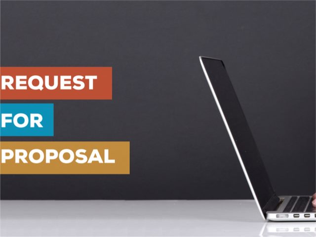Request for proposal concept with a laptop on a desk.