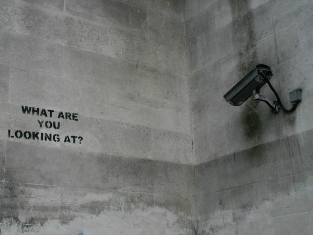 security camera and graffiti