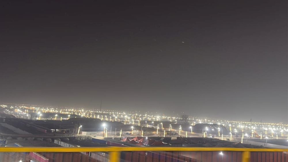 Illuminated Mela ground at night at Maha Kumbh 2025.
