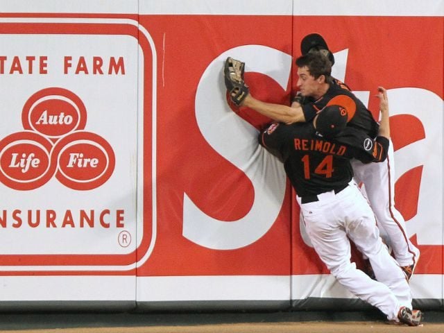 Baseball players outfield crash