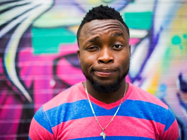 Man in Red and Blue V-Neck Shirt