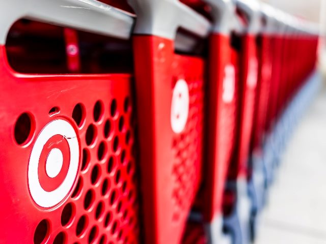 Many rows of red shopping carts outside of Target store. 