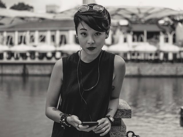 skeptical looking woman staring directly at camera