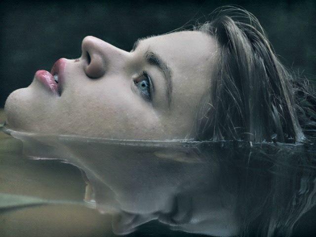 woman trying to keep her head above water