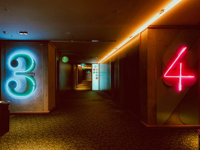 neon signs with the numbers 3 and 4