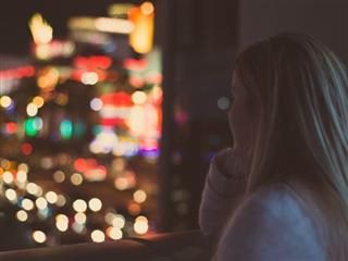woman looking out window