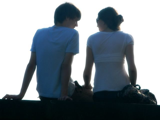 man and woman talking