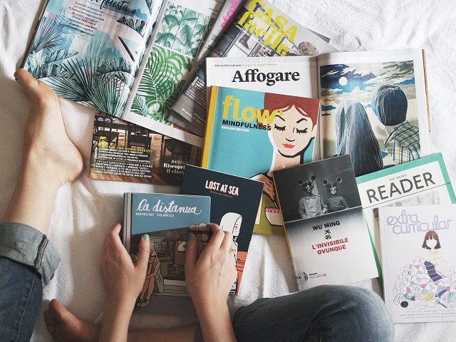 An assortment of books on a bed