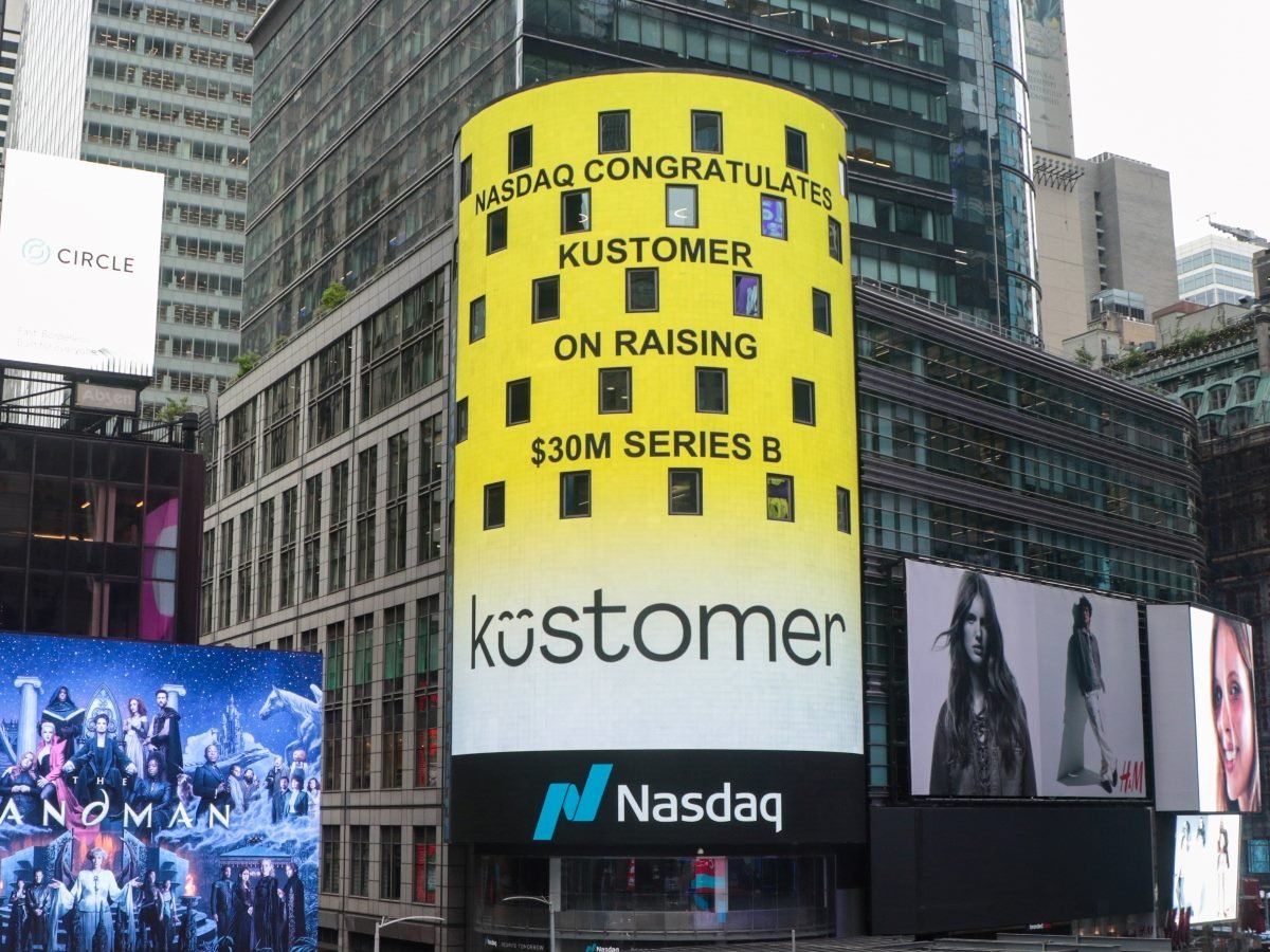 Nasdaq tower in New York City displays a bright yellow digital billboard congratulating Kustomer on raising $30 million in Series B funding.