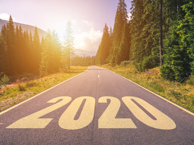 Empty asphalt road with 2020 painted on the road. 