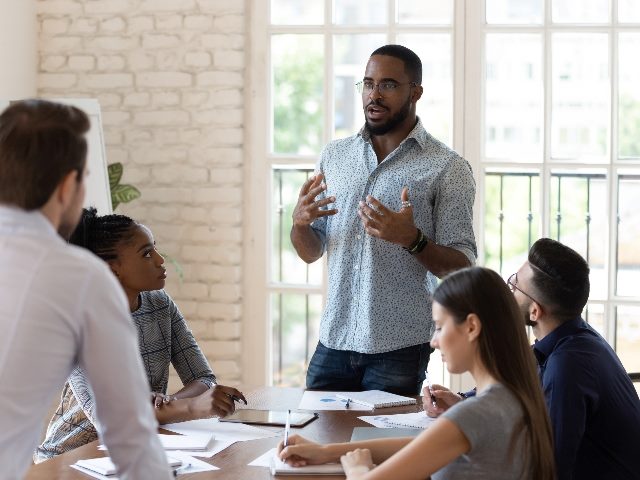 Black business man talking in a meeting
