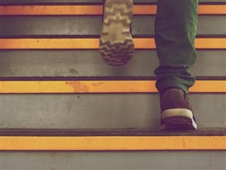 person walking up stairs