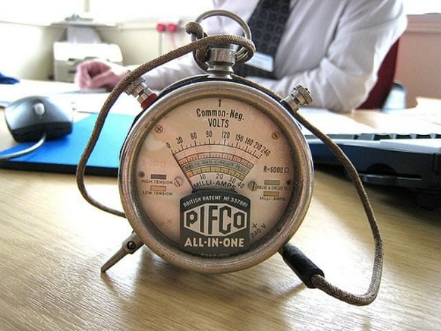 volt meter on a person's desk