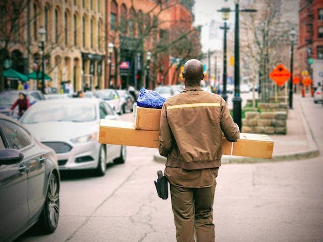 UPS deliveryman carrying packages