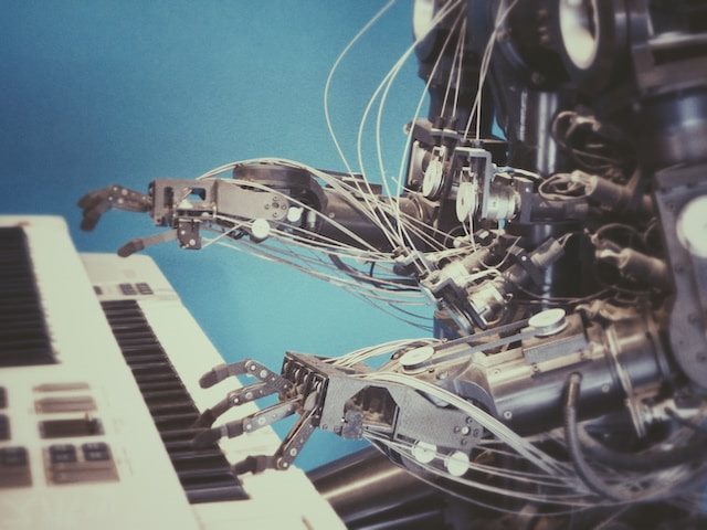 A robot playing a keyboard.