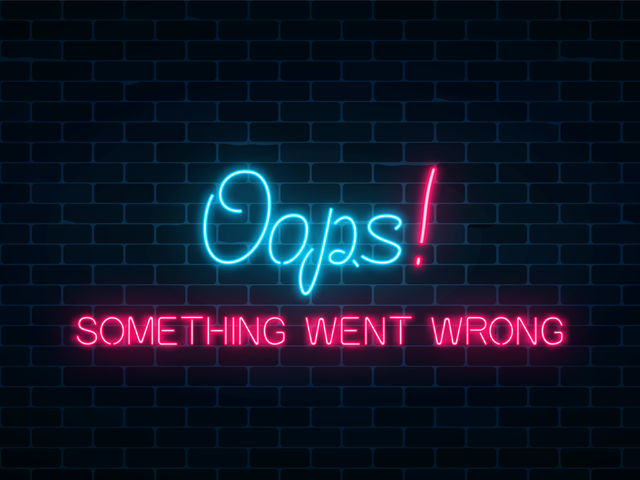 A neon sign that says Oops, Something Went Wrong on a darkly lit brick wall