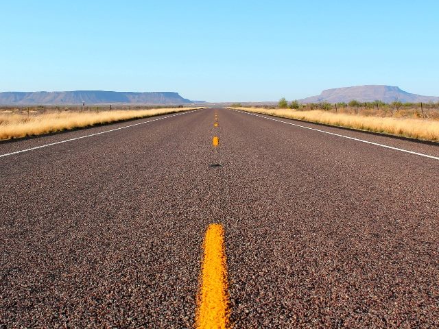 Endless open straight road in Big Bend National Park in Texas in piece about 2024 trends for Umbraco. 