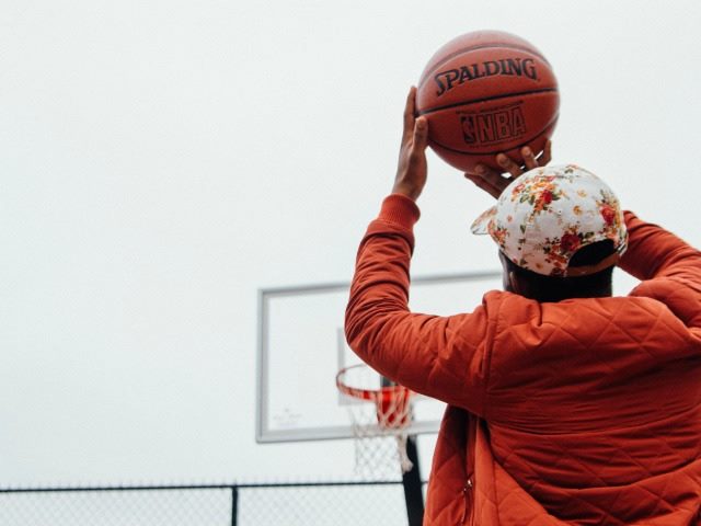 taking a shot in basketball