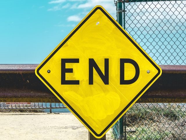 A warning sign that says END - ECM migrates to the cloud concept
