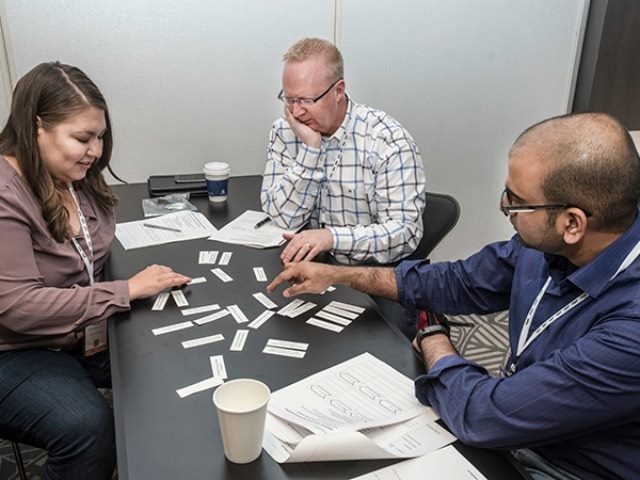 DX Summit 16 attendees working together to solve a problem