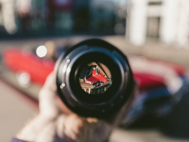 looking at a car through a camera lens