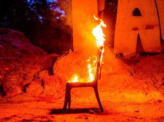  Wooden chair is on fire. 