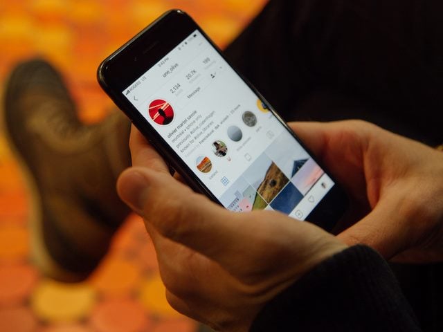 person looking at instagram on a phone
