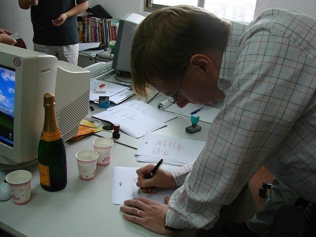 A man signs a contract