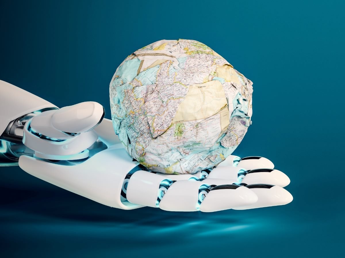 A robotic hand holds a crumpled paper globe, symbolizing artificial intelligence shaping or reshaping global understanding and knowledge.