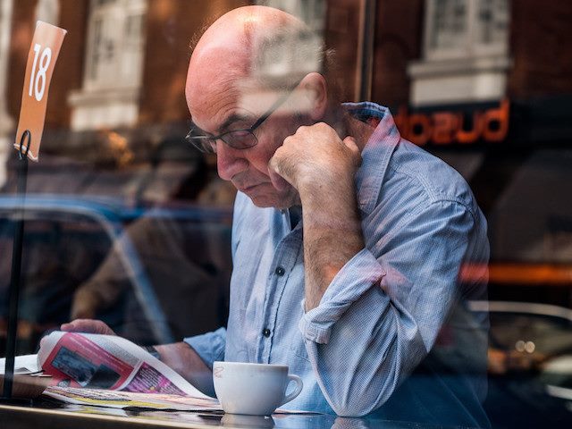 man reading paper