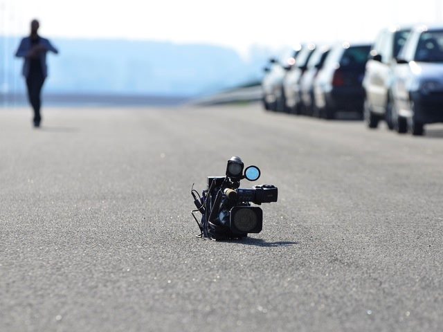 Video camera on asphalt road