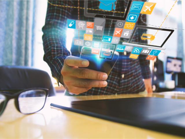A community manager responding to an instant message on his smartphone