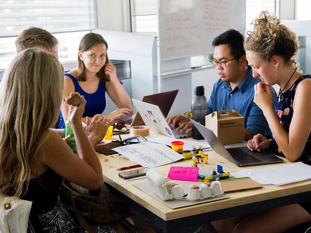 Group of workers collaborating at a table.