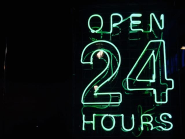 neon sign reading "open 24 hours"