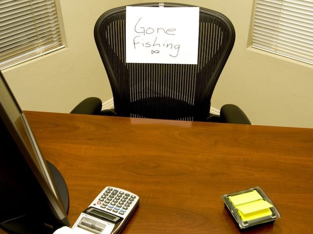 office chair with sign "gone fishing" taped on it