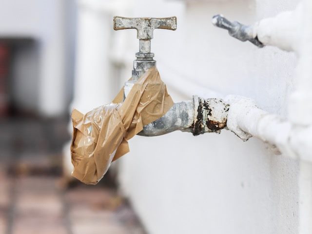 a water spigot taped shut