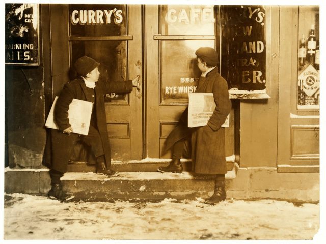 Two newspaper boys about to enter a bar to sell back in 1909 in Hartford, Conn.