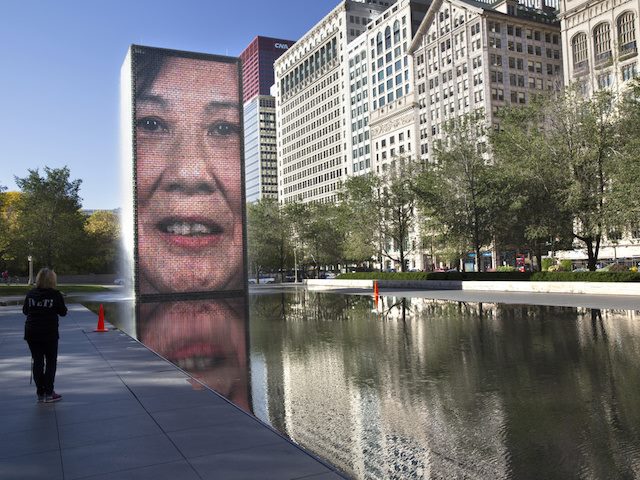 tall, narrow fountain in millenium park which features videos of Chicago residents