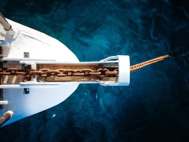 chain going into the water from a white boat