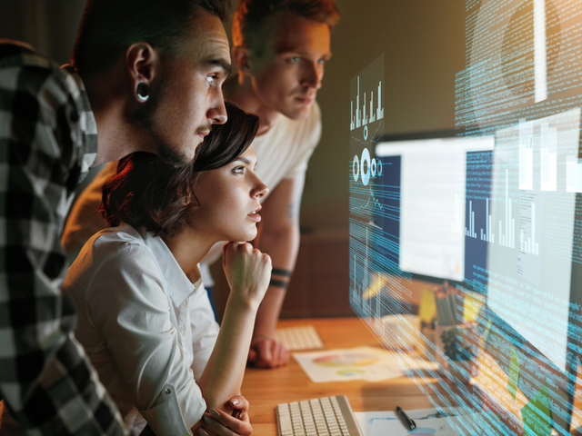 Employees in an office working with a new app