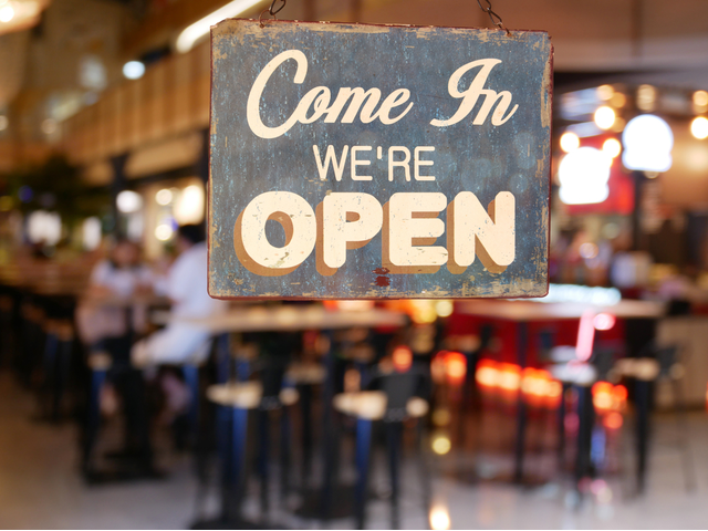 A sign that reads, "Come in. We're Open."