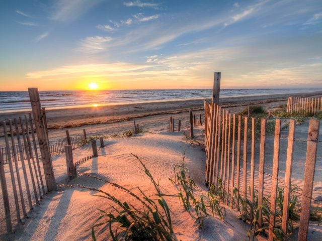 Sunrise as seen from the sand dunes at the Outer Banks, NC around Corolla Beach in September. 