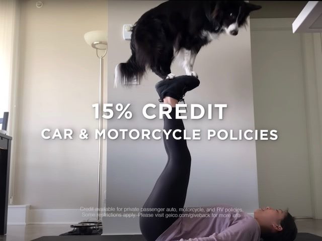Geico ad with woman balancing dog on her feet in the air