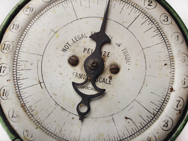 close up of a vintage grocery scale