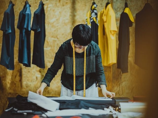 tailor studying a pattern
