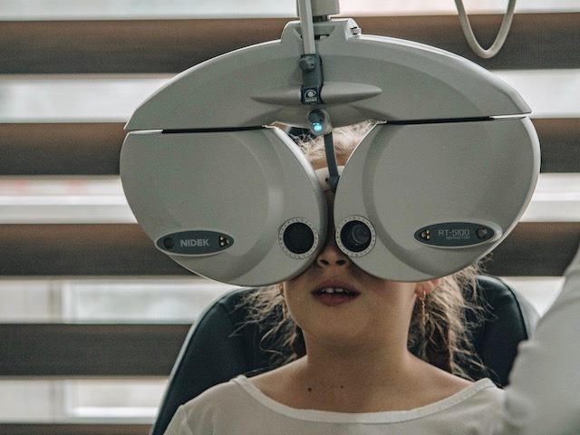 girl getting an eye exam