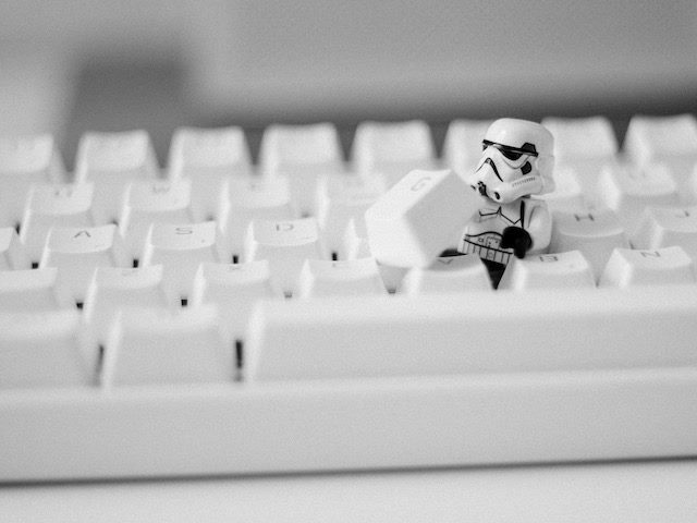 storm trooper figurine working in keyboard