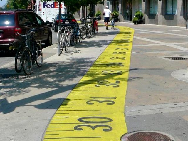 measuring tape painted on a sidewalk