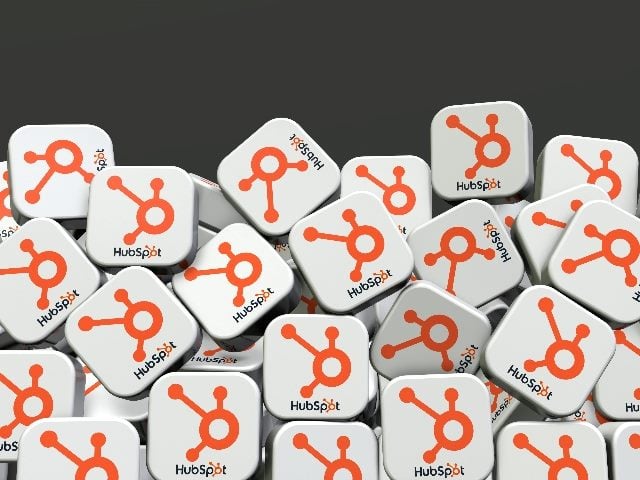 HubSpot's social media logos in the shape of dice. 