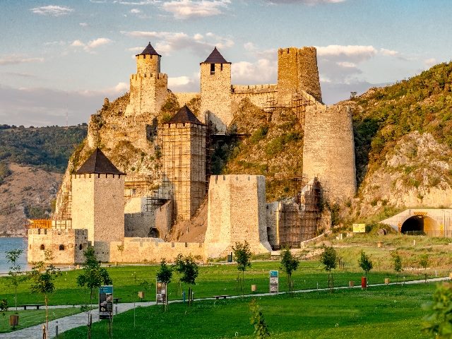 Golubac fortress  on a sunny day on the Danube River in Serbia with six siloed towers in piece about organizational silos. 